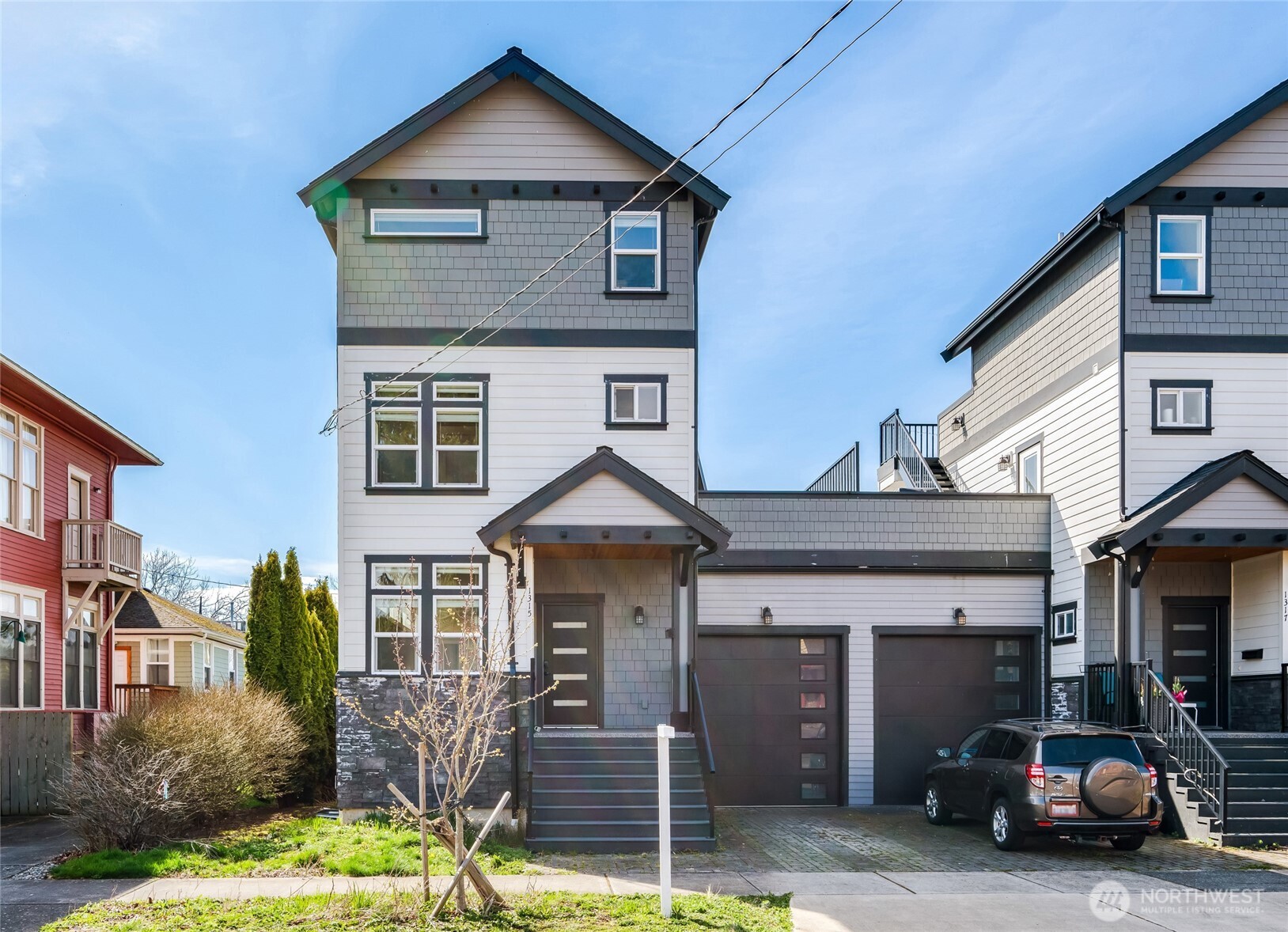 1315 Astor Street Bellingham, WA 98225 - Photo 3 of 34 a front view of a house with garden