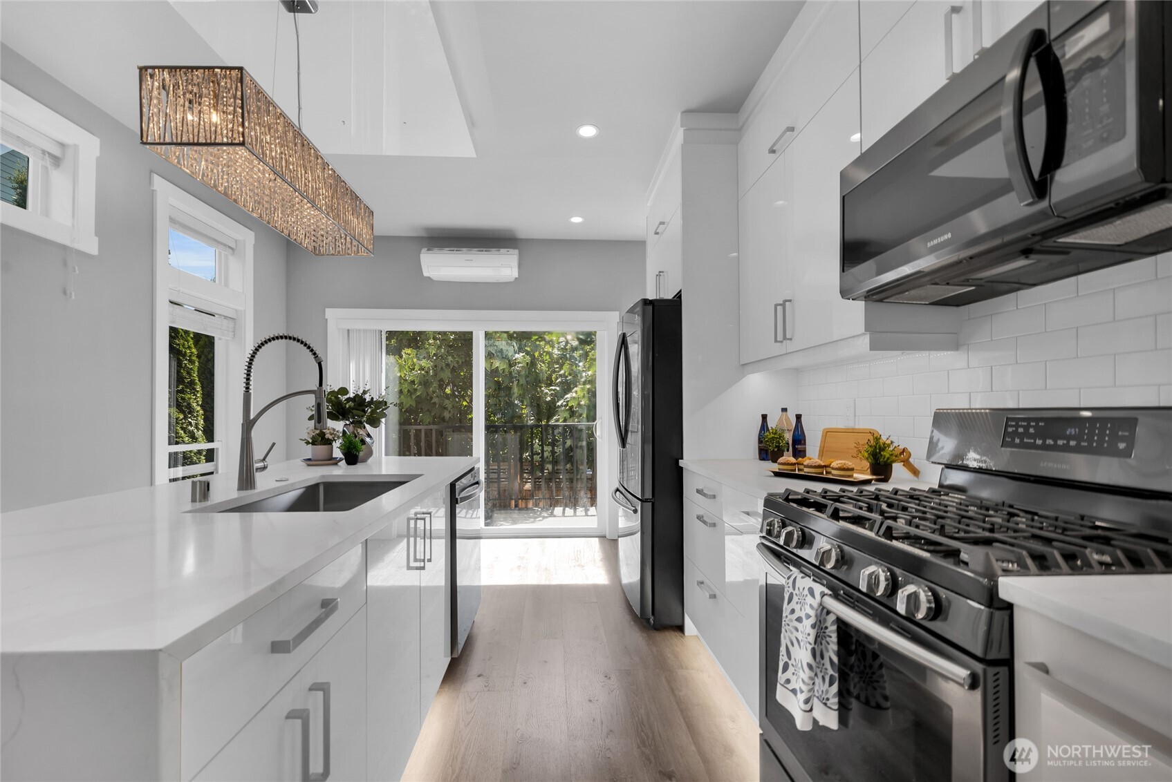 1315 Astor Street Bellingham, WA 98225 - Photo 6 of 34 a kitchen with granite countertop a stove and a sink