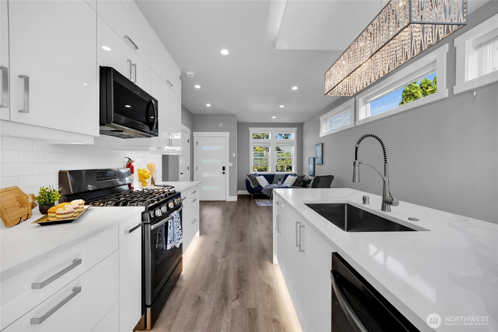 1315 Astor Street Bellingham, WA 98225 - Photo 9 of 34 a kitchen with stainless steel appliances granite countertop a sink stove and refrigerator