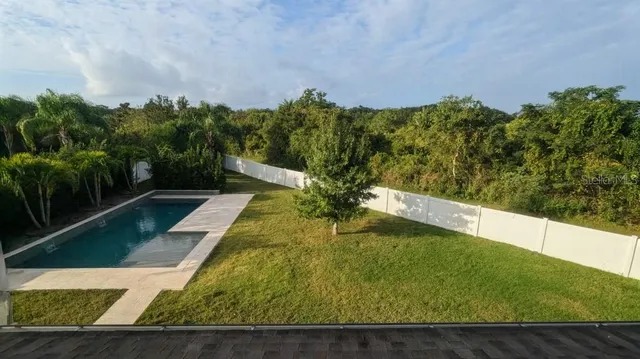 a view of a yard with an outdoor seating
