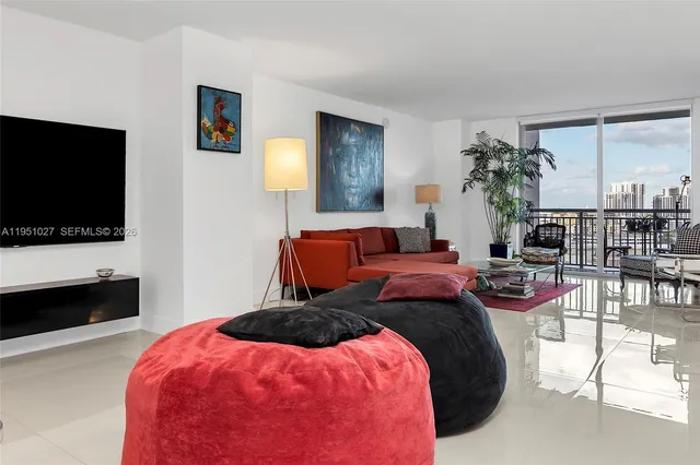 a living room with furniture and a flat screen tv