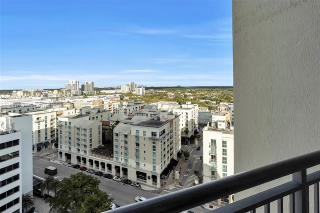 a balcony with table and chairs