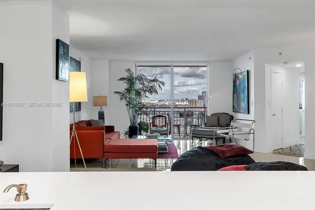 a kitchen with stainless steel appliances a refrigerator sink and cabinets