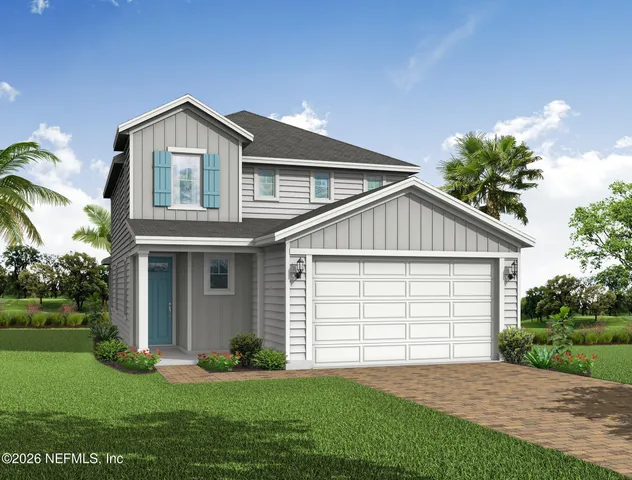 a view of a house with a yard and potted plants
