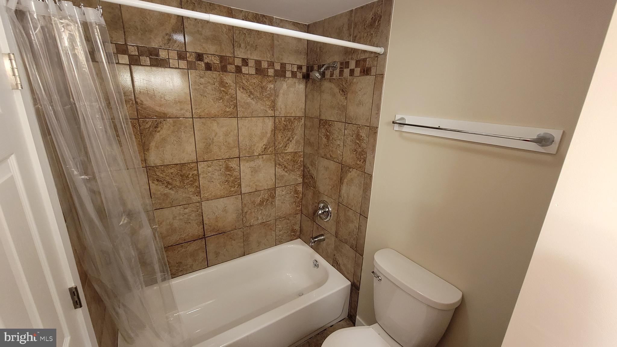 222 State Street Enola, PA 17025 - Photo 17 of 42 a bathroom with a bathtub and shower