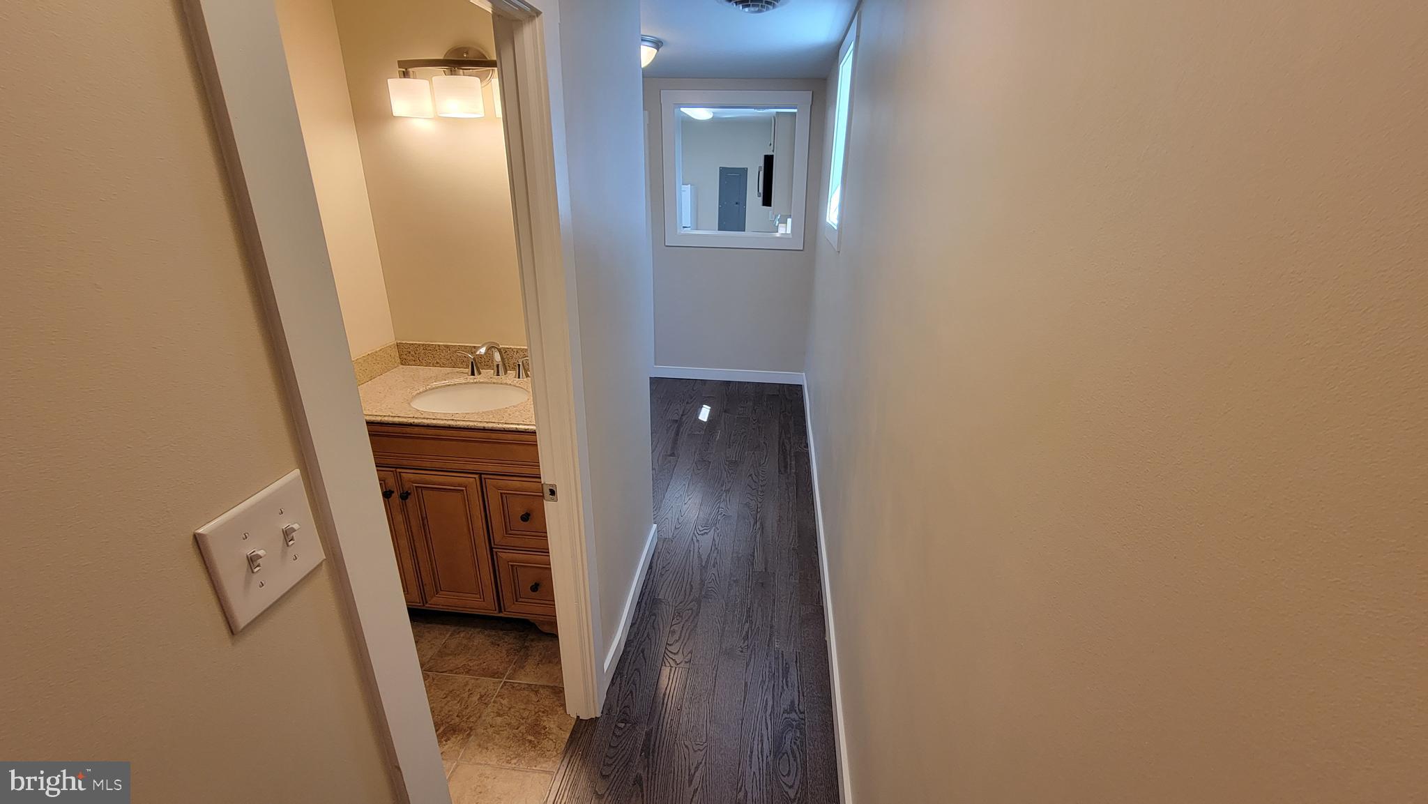 222 State Street Enola, PA 17025 - Photo 19 of 42 a view of hallway with sink and wooden floor