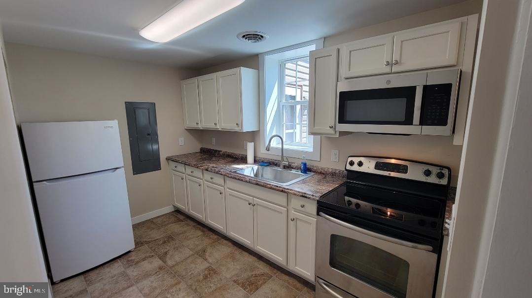 222 State Street Enola, PA 17025 - Photo 26 of 42 a kitchen with a refrigerator stove and microwave