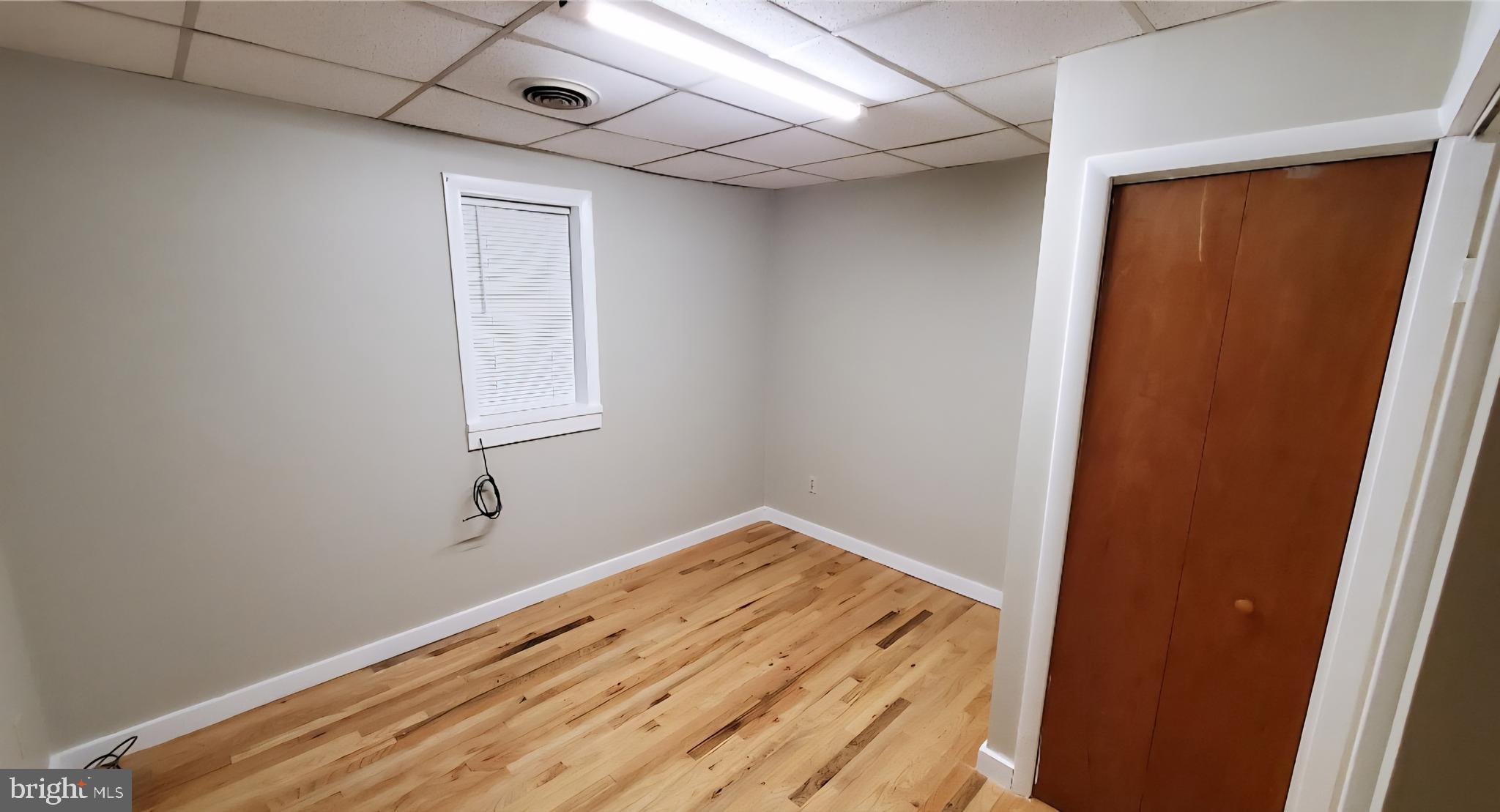 222 State Street Enola, PA 17025 - Photo 7 of 42 a view of empty room with wooden floor and fan