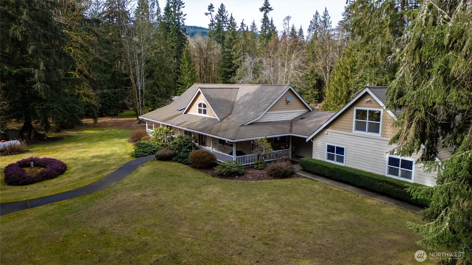 6170 Rutsatz Road Deming, WA 98244 - Photo 40 of 40 a view of a house with a yard and sitting area