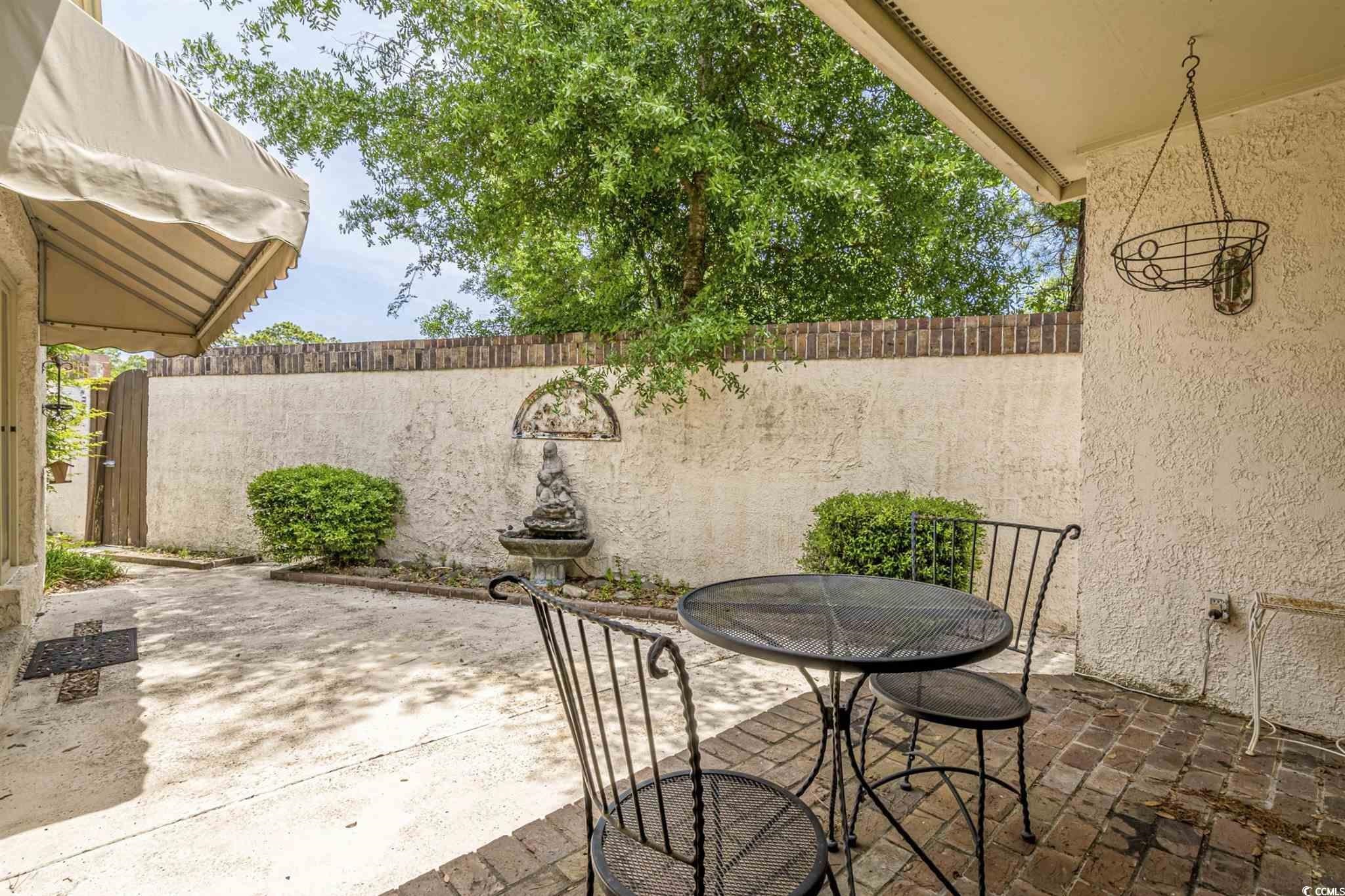 5 San Marks Court Myrtle Beach, SC 29572 - Photo 32 of 42 Fenced backyard featuring a patio and outdoor dining space