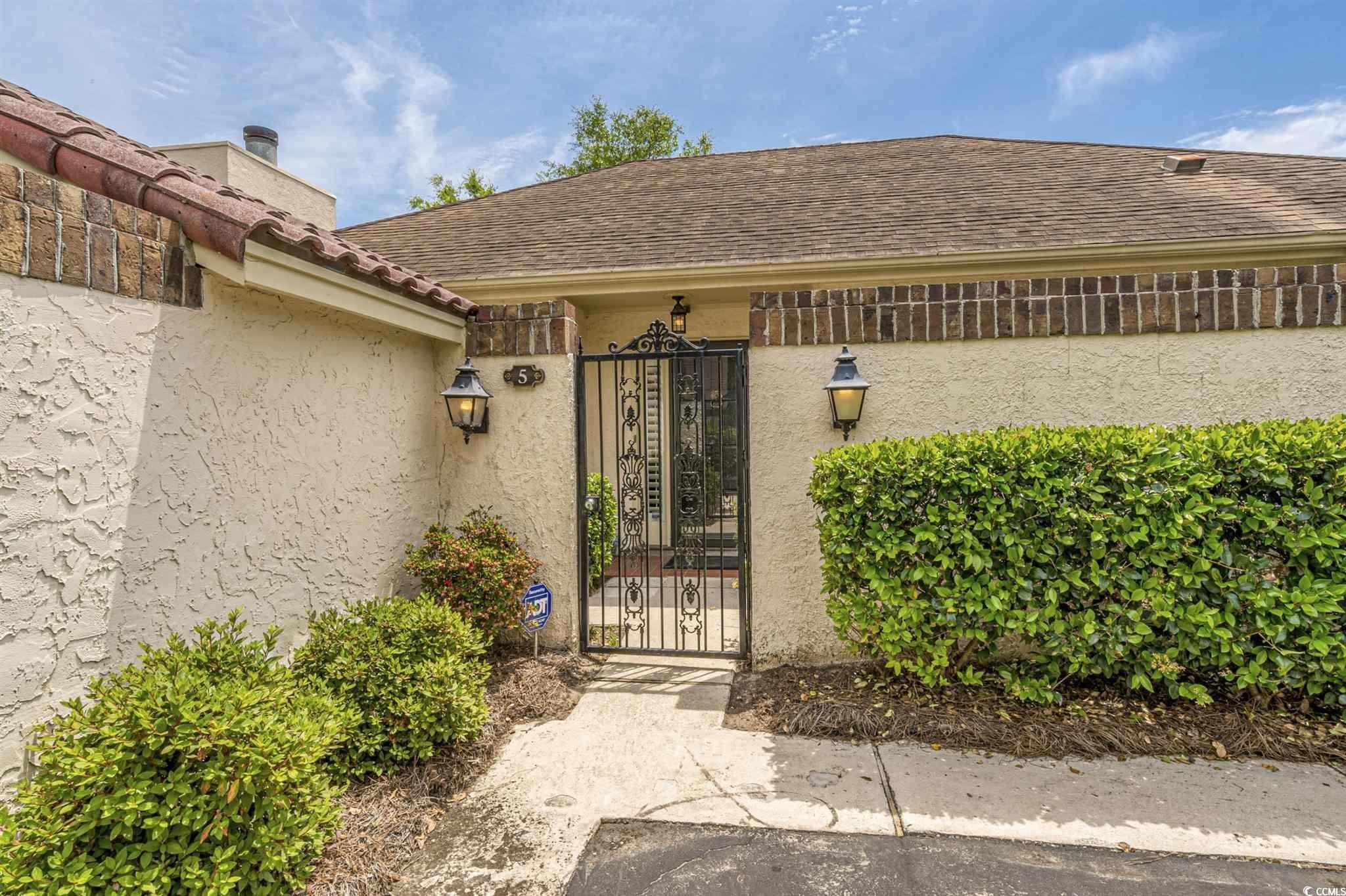 5 San Marks Court Myrtle Beach, SC 29572 - Photo 35 of 42 Entrance to property with a gate and stucco siding