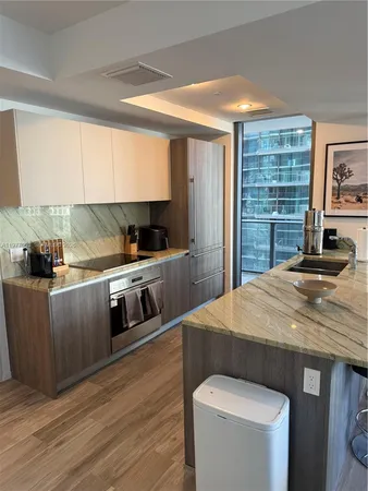a room with dining table and wooden floor
