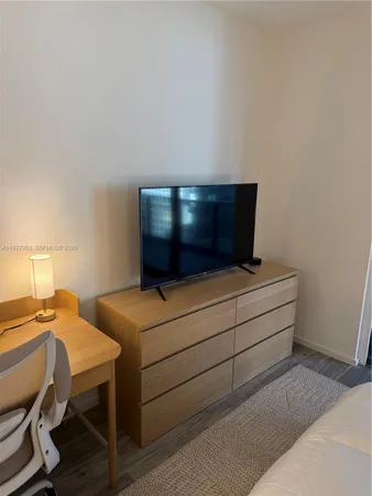 a room with furniture and a wooden floor