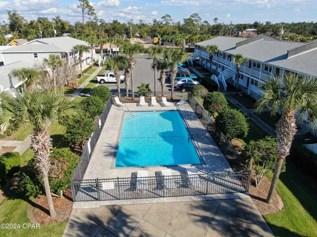 a view of a swimming pool with a patio