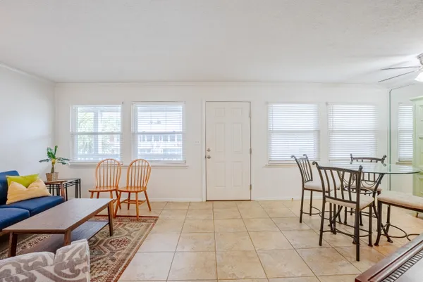 a dining room with furniture and window