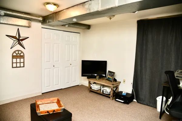 a room with furniture and flat screen tv