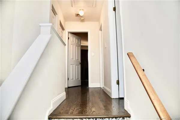a view of entryway with wooden floor