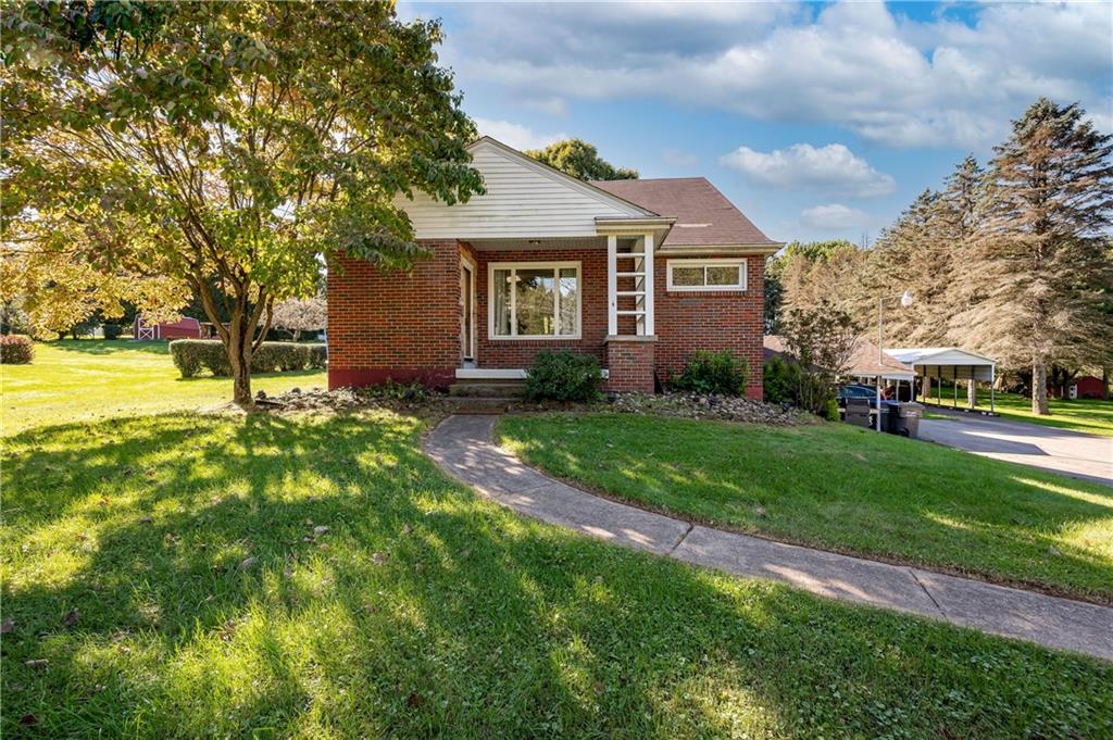 320 Holyoke Road Butler, PA 16001 - Photo 2 of 15 a view of a yard in front of a house with a big yard