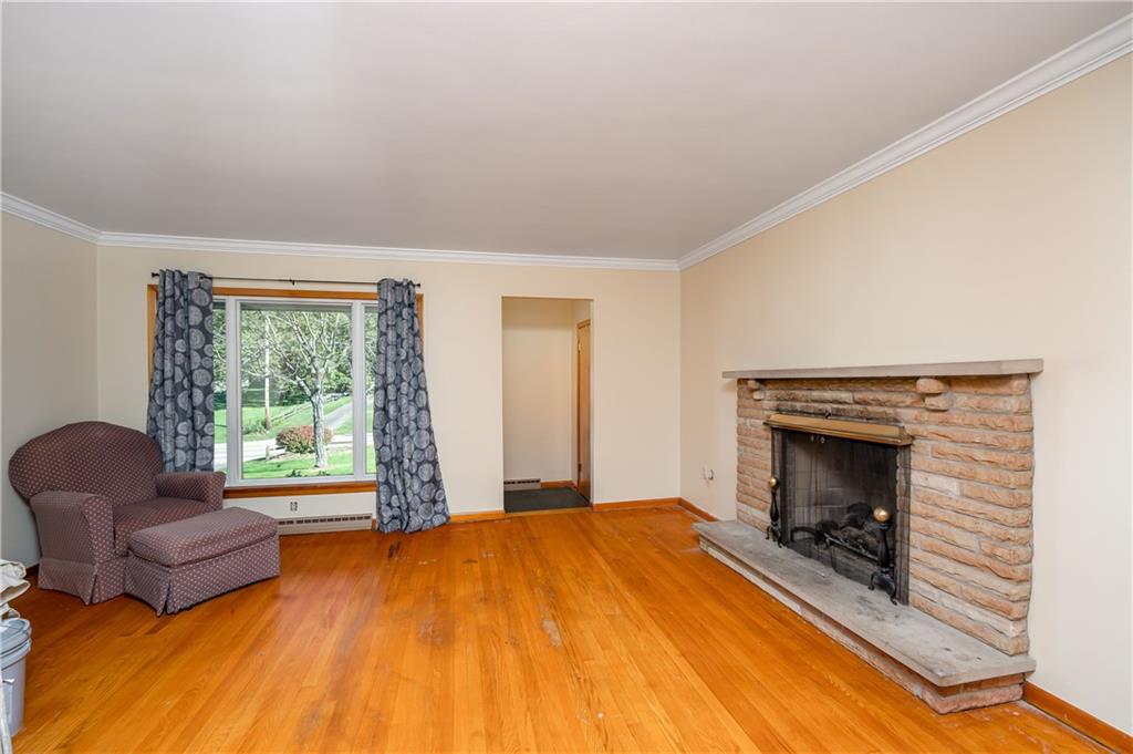 320 Holyoke Road Butler, PA 16001 - Photo 3 of 15 a bedroom with a bed and a fireplace