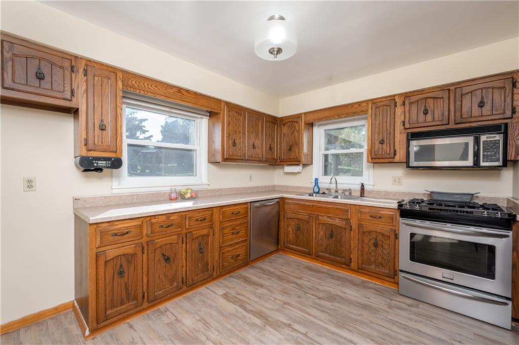 320 Holyoke Road Butler, PA 16001 - Photo 6 of 15 a kitchen with wooden cabinets and stainless steel appliances