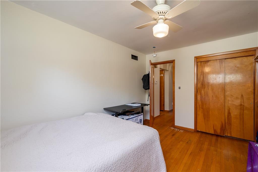 320 Holyoke Road Butler, PA 16001 - Photo 8 of 15 a bedroom with a bed and a chandelier