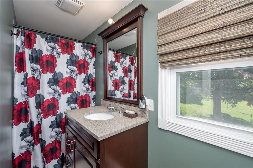 320 Holyoke Road Butler, PA 16001 - Photo 9 of 15 a bathroom with a sink and a mirror