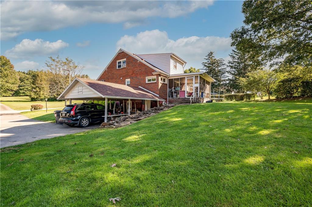 320 Holyoke Road Butler, PA 16001 - Photo 10 of 15 a view of a big house with a big yard and large trees
