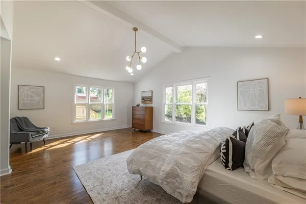 a bed room with a bed and a window