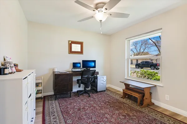 a workspace with furniture and window