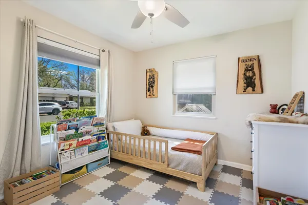 a bedroom with furniture and a window