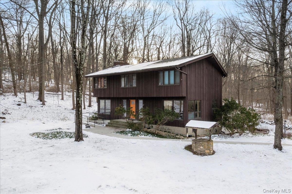 111 Philipse Brook Road Garrison, NY 10524 - Photo 2 of 22 a view of a house with a yard covered in snow