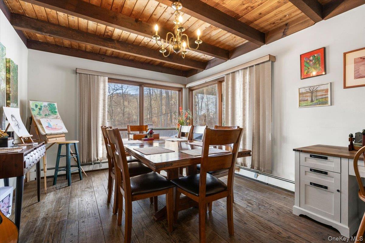 111 Philipse Brook Road Garrison, NY 10524 - Photo 6 of 22 a view of a dining room with furniture window and wooden floor