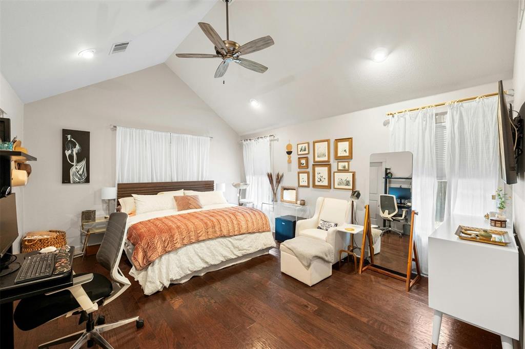 2802 Warren Street, Unit A Austin, TX 78703 - Photo 15 of 29 a bedroom with a bed and wooden floor