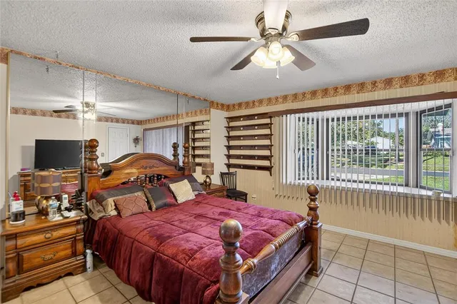 a bed room with a bed and a television