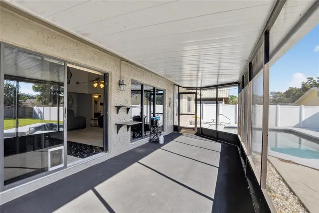 a view of a patio with table and chairs