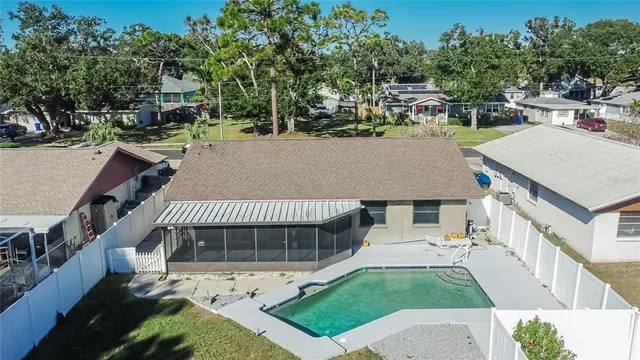 a view of a house with backyard and garden