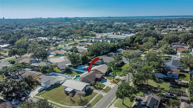 a front view of a house with a garden and yard