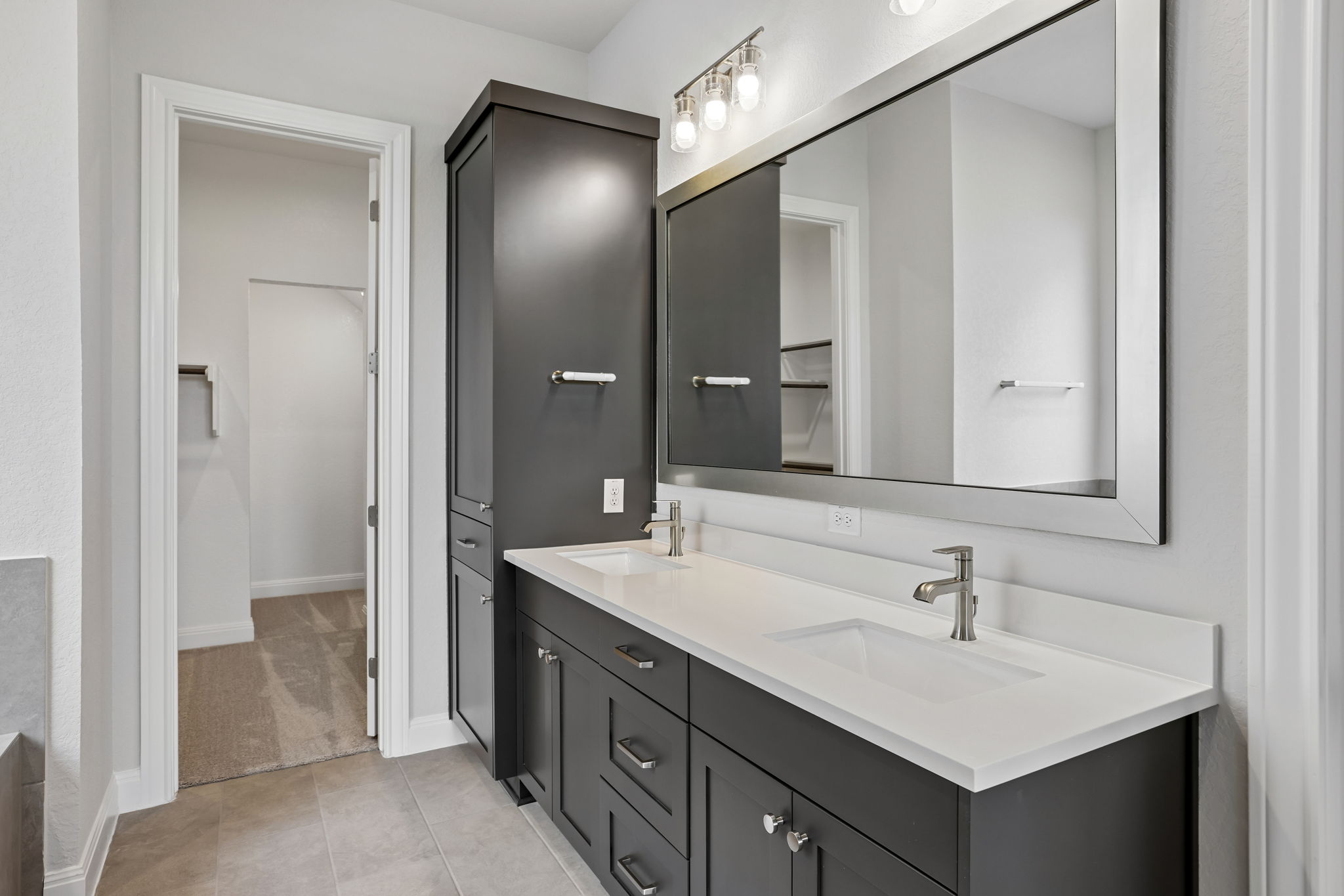 214 Prickly Poppy Loop Kyle, TX 78640 - Photo 21 of 38 a bathroom with a sink double vanity and a mirror