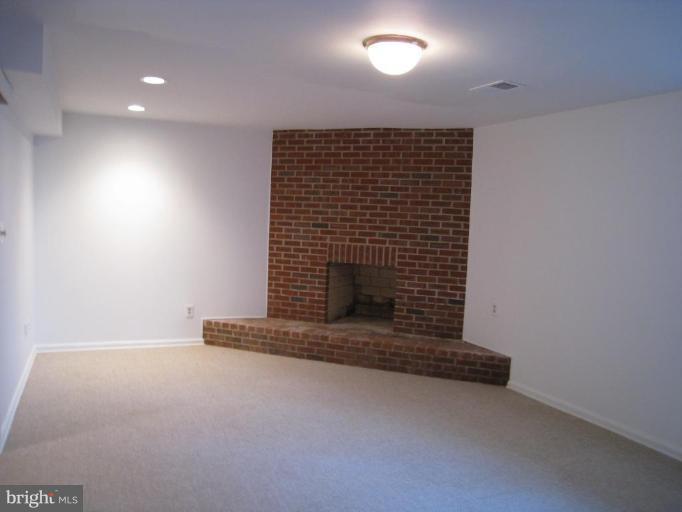1602 Apricot Court Reston, VA 20190 - Photo 9 of 10 Recreation Room w/Fireplace