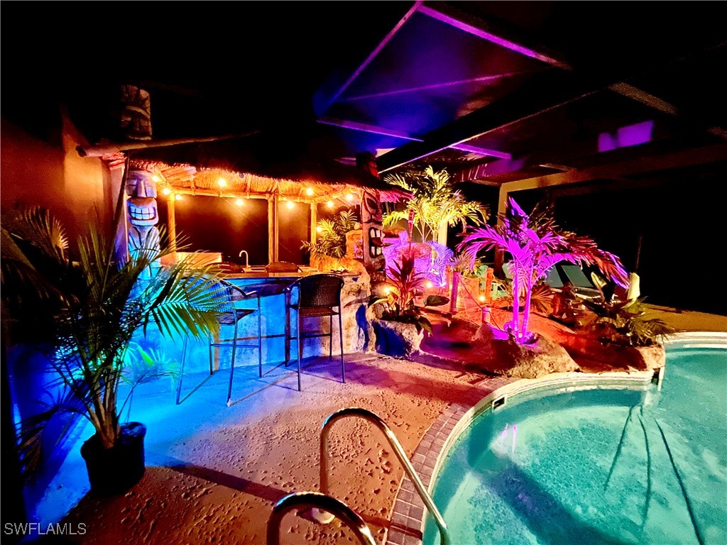 5216 Rutland Court Cape Coral, FL 33904 - Photo 13 of 47 a view of swimming pool with a patio