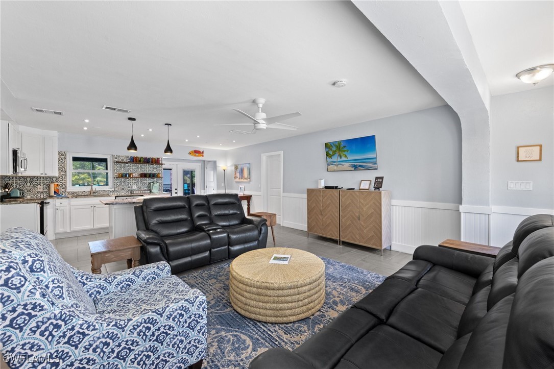 5216 Rutland Court Cape Coral, FL 33904 - Photo 16 of 47 a living room with furniture and a dining table