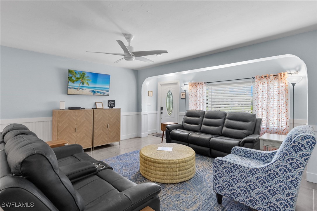 5216 Rutland Court Cape Coral, FL 33904 - Photo 17 of 47 a living room with furniture and a chandelier