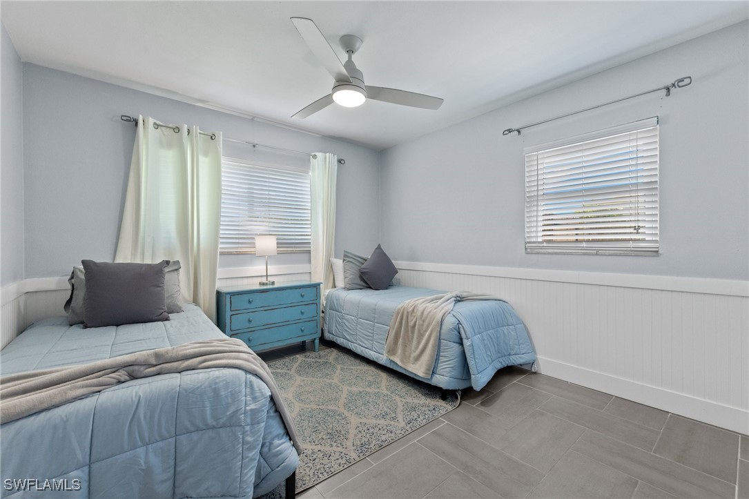 5216 Rutland Court Cape Coral, FL 33904 - Photo 29 of 47 a bedroom with two beds and a window