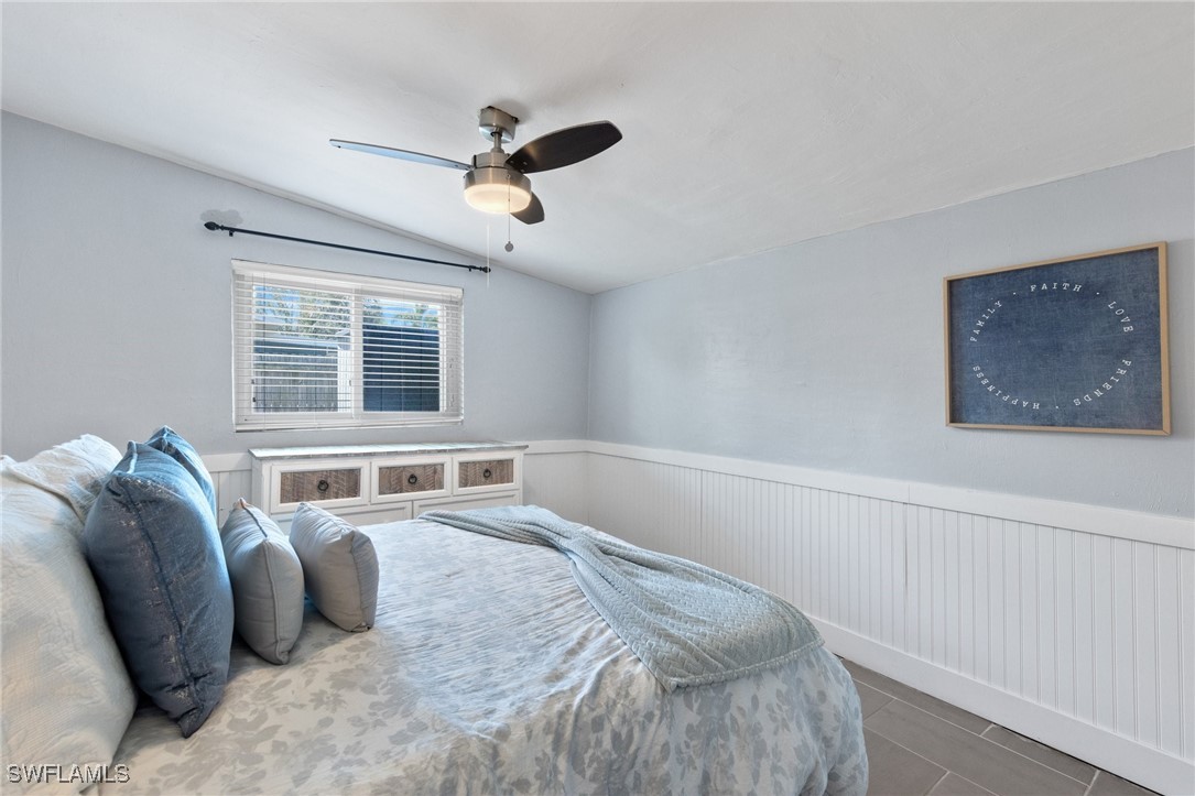 5216 Rutland Court Cape Coral, FL 33904 - Photo 30 of 47 a bedroom with a large bed and a window