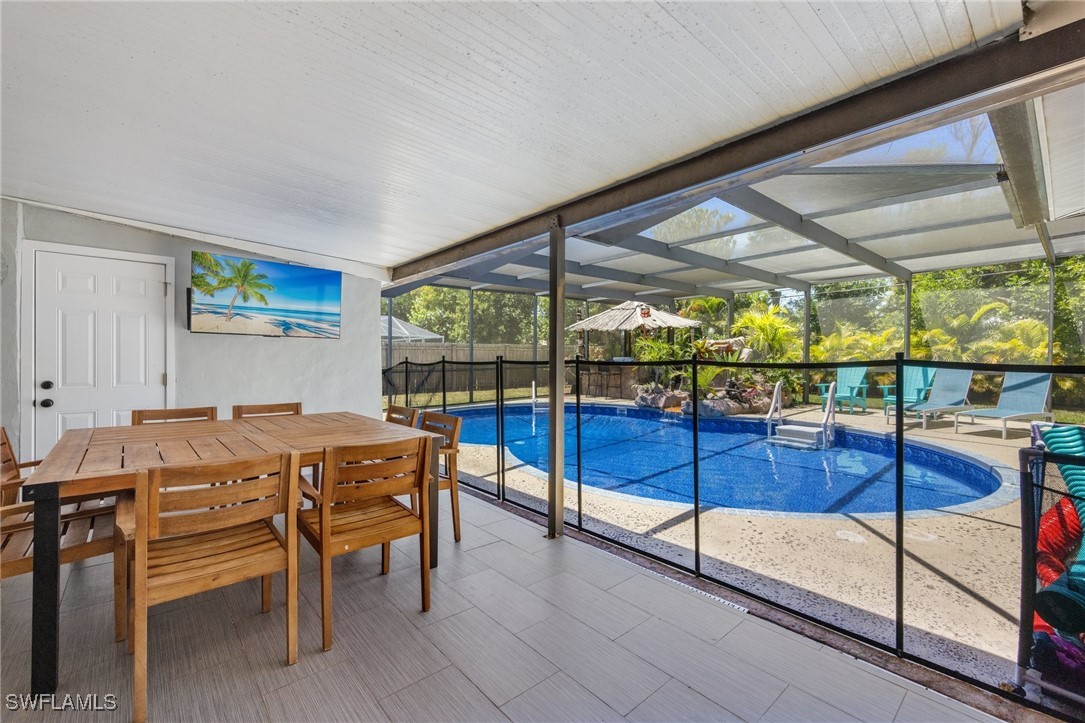 5216 Rutland Court Cape Coral, FL 33904 - Photo 32 of 47 a view of a dining room with furniture window and outside view