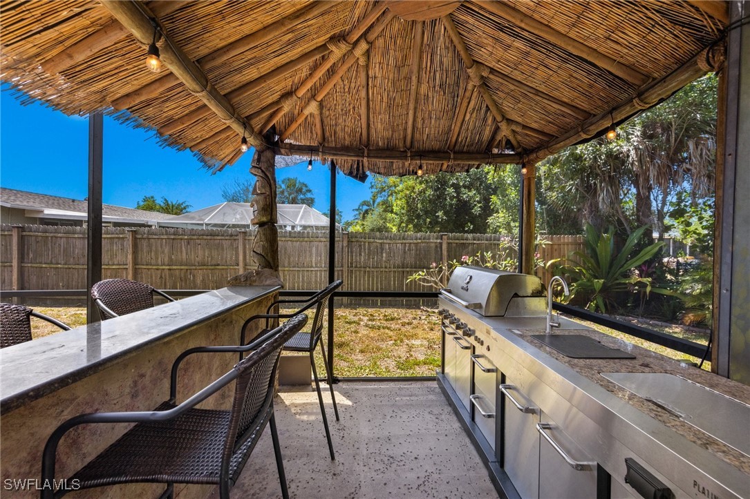 5216 Rutland Court Cape Coral, FL 33904 - Photo 37 of 47 a view of an outdoor sitting area