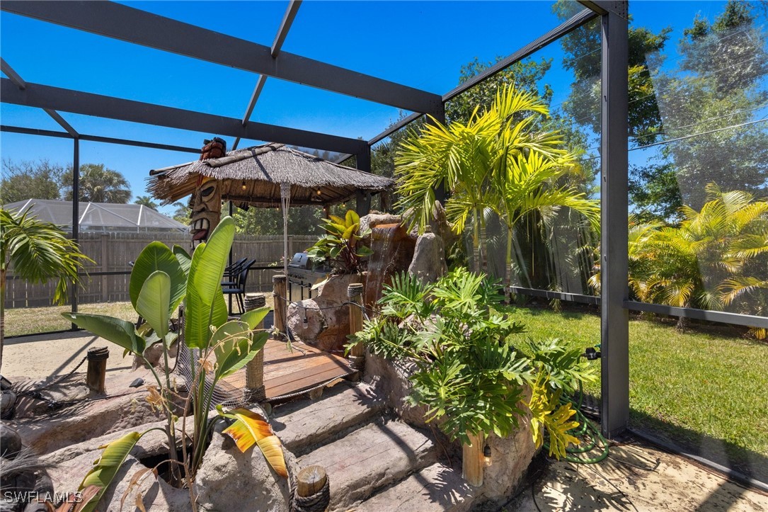 5216 Rutland Court Cape Coral, FL 33904 - Photo 40 of 47 a view of a backyard with plants