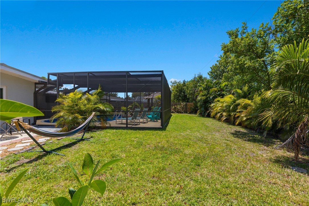 5216 Rutland Court Cape Coral, FL 33904 - Photo 42 of 47 a view of a backyard with plants and a patio
