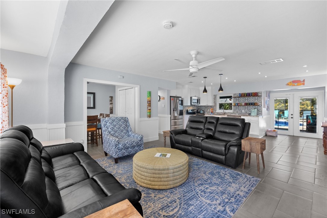 5216 Rutland Court Cape Coral, FL 33904 - Photo 7 of 47 a living room with furniture and wooden floor