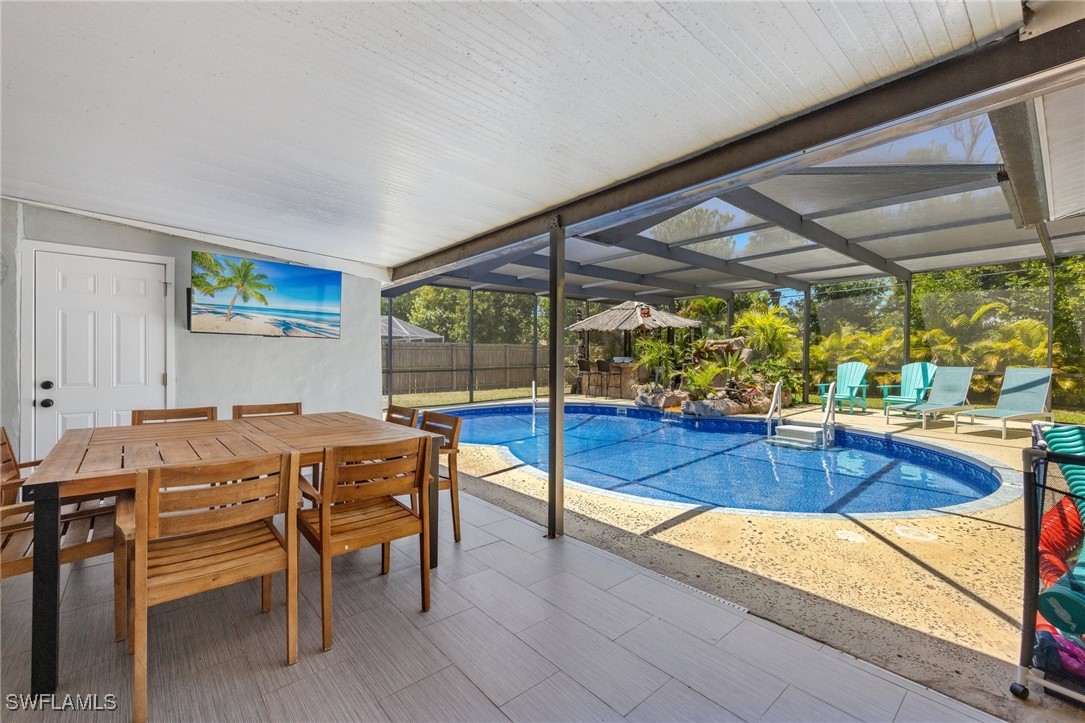 5216 Rutland Court Cape Coral, FL 33904 - Photo 8 of 47 a view of a dining room with furniture wooden floor and a potted plant